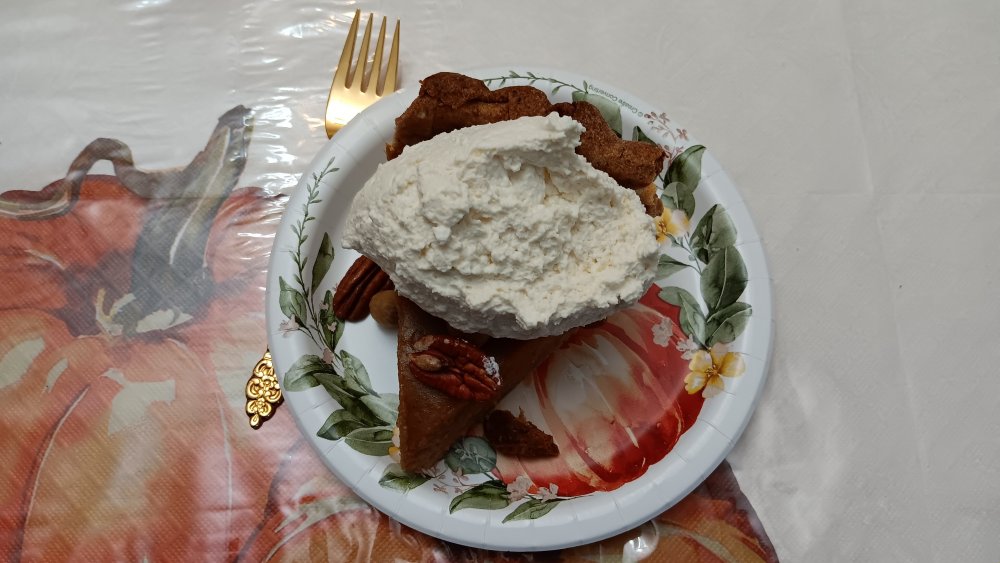 Pumpkin Pie slice with whipped cream and nuts.jpg